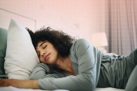 a photo of a woman sleeping in bed