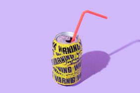 a photo of a can with a straw coming out of it and "Warning" tape wrapped around it