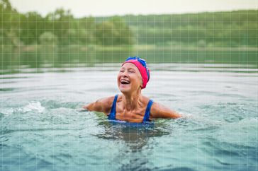 a photo of a woman swimming outside