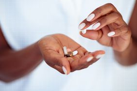 a photo of hands holding supplements 
