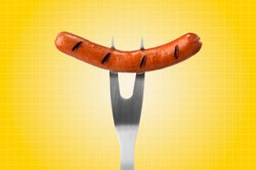 a photo of a hot dog on a fork