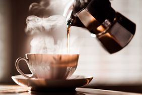 a photo of coffee being poured into a mug