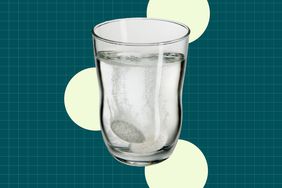 a photo of a glass of water with an antacid dissolving